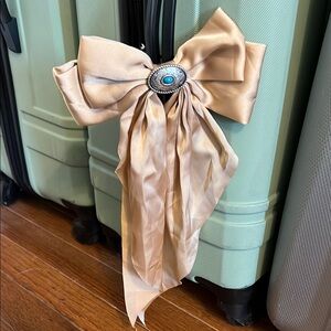 Elegant Tan Bow Accent with Turquoise Detail